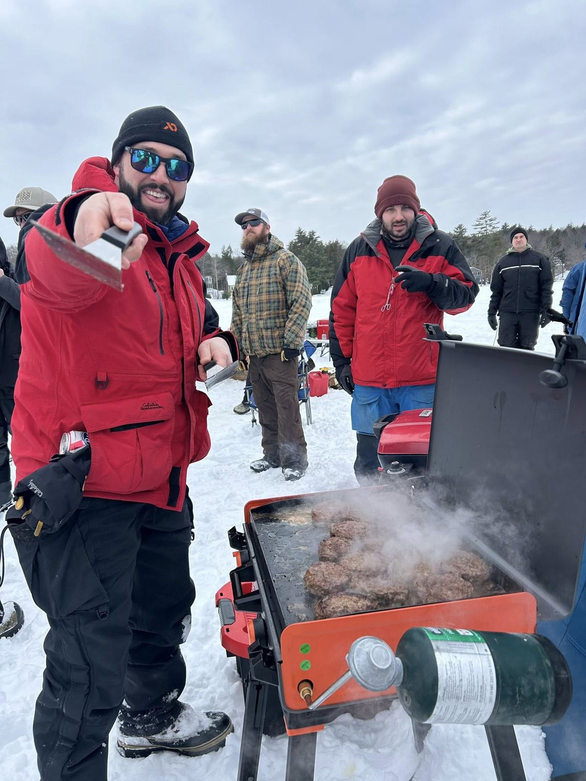 Grilling burgers on the ice at a Fishing for Freedom event
