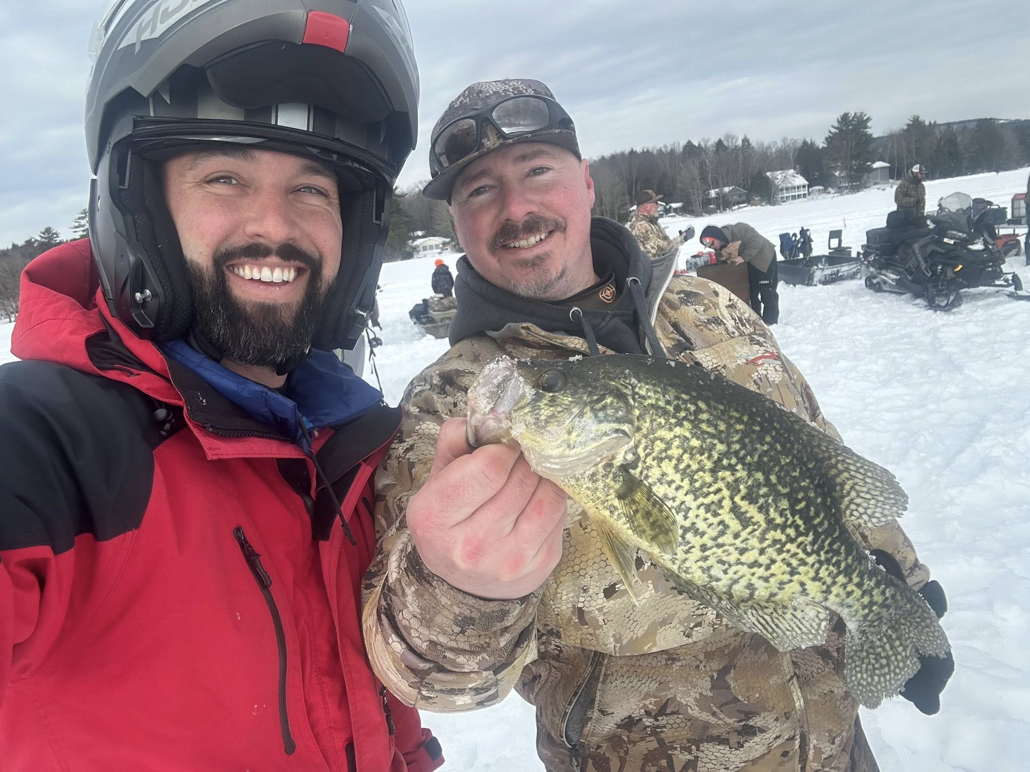 Two members showing off a great crappie catch at a Fishing for Freedom outing